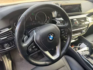 Легковой автомобиль BMW 520i VIN X4XJA19480WC06408 2018 года выпуска, черный. На ходу, документы и ключи в наличии.