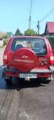 Chevrolet Niva 2008 года выпуска, модель 212300. VIN: X9L21230080249645. Двигатель: 2123 0261285, бензиновый, мощность 79.6 л.с. Цвет: ярко-красный металлик. Состояние удовлетворительное: повреждена левая задняя дверь, не работает кондиционер, имеются сколы и ржавчина.