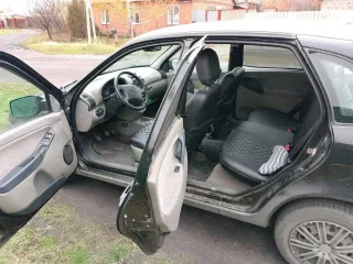 Лада Калина 2010 года, VIN: XTA111940A0113921, цвет черный.