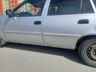 Daewoo Nexia 2009, модель: Нексия, год изготовления: 2009, цвет: перламутрово-серебр