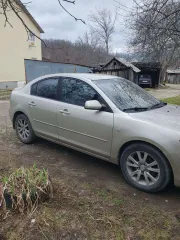 Легковой автомобиль Mazda 3 2006 года выпуска, цвет серо-золотистый, VIN JMZBK12Z571571228