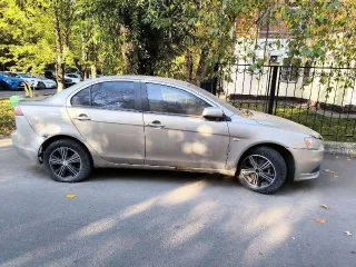 Mitsubishi Lancer 2011 Легковой седан Mitsubishi Lancer 1,5, VIN: JMB5NCY2ABU006835, год выпуска: 2011, цвет: бежевый, тип двигателя: бензиновый, мощность двигателя: 109 л.с. (80,2 кВт), объем двигателя: 1499 куб.см., экологический класс: четвертый. По периметру автомобиля наблюдаются очаги…