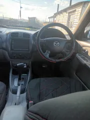 Mazda Familia 2001 года выпуска, идентификационный номер (VIN) отсутствует, номер кузова NBJ5W306594.