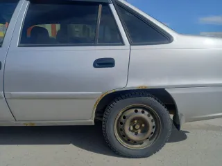 Daewoo Nexia 2009, модель: Нексия, год изготовления: 2009, цвет: перламутрово-серебр