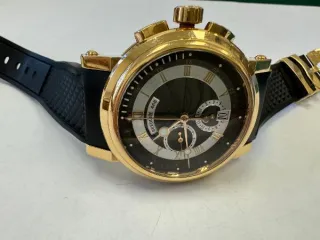 Breguet Marine Chronograph RG ref. 5827BR/Z2/5ZU наручные часы, корпус круглый, из металла золотистого цвета, ремешок из материала черного цвета с замком из металла золотистого цвета. На оборотной стороне штампованная надпись «HORLOGER DE LA», «MARINE», «BREGUET», «468 BP Au750», «REF 5827», б/у…