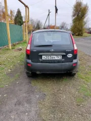 Лада Калина 2010 года, VIN: XTA111940A0113921, цвет черный.