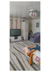 Земельный участок и жилой дом в селе Бобровка Челябинской области по адресу: Челябинская область, Троицкий район, село Бобровка, улица Красных Партизан, дом 15. Кадастровые номера: 74:20:2307001:141 (земельный участок) и 74:20:2307001:761 (жилой дом).