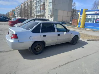 Daewoo Nexia 2009, модель: Нексия, год изготовления: 2009, цвет: перламутрово-серебр