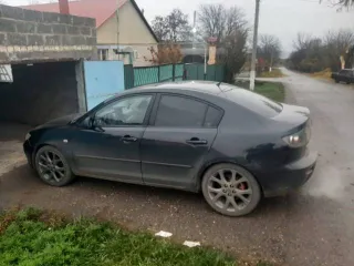 Mazda 3 2005 года выпуска, черный цвет. VIN: JMZBK12Z561296176, госномер: М815АС126. Мощность двигателя 77 л.с. (105 кВт), рабочий объем 1598 куб. см.