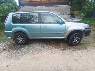 Автомобиль Nissan X trail 2003 года. Двигатель      бензин, 2,5л. Мощность   165 л.с.,Коробка передач      АКПП , Привод   передний, + 4WDс кнопки,Цвет   серый, Пробег   202 200км, Руль   левый