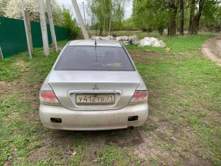 Мицубиси лансер 1,6 2003 года, VIN JMBSRCS3A4U002962.