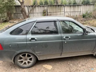LADA Priora 2009 217230 LADA Priora серо-сине-зеленый легковой комби (хэтчбек), год выпуска 2009, рабочий объем двигателя 1596 куб. см, мощность 97.9 л.с. (72 кВт), государственный регистрационный знак Н834ТС 55, VIN XTA21723090048304, цвет серо-сине-зеленый, СТС 99 60 № 897575 от 09.07.2024г., ПТС…