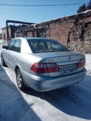 Автомобиль Mazda Capella 2000 года выпуска, серебристый цвет. Государственный номер А245РР27. Кузов GF8P 201936. Разрешенная максимальная масса 1490 кг, масса без нагрузки 1180 кг.