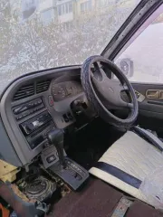 Nissan Largo 1994 года, 79 л.с., пробег 202381 км, АКПП, задний привод. Госномер Т844ВО49. Двигатель дизельный CD20-405989Х, объем 1973 см³, мощность 79 л.с. Кузов VNW30011917, серый цвет. Состояние: требуется полный ремонт и покраска кузова, значительная коррозия. Лобовое стекло с трещиной…