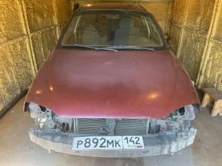 Легковой автомобиль Kia Spectra, 2008 года. Цвет: красный перец, VIN: XWKFB227380085200, госномер: Р892МК142. Технические особенности: автомобиль не на ходу, отсутствуют колеса, элементы молдинга, салона, отсутствуют передний и задний бампер, радиаторная решетка, передние и задние фары.