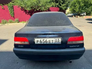 Toyota Carina, 1990 год выпуска, регистрационный знак Р656ЕТ03RUS, VIN не установлен, цвет темно-синий.