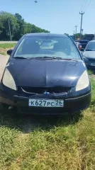 Легковой автомобиль Mitsubishi Colt 1.3 2008 года выпуска, черный цвет кузова. VIN: XMCXJZ34A8F072797, регистрационный знак К627РС 26. Объем двигателя 1332 см³, мощность 95 л.с. Отсутствуют ключи и документы. Состояние: трещины на переднем бампере; сломано крепление с правой стороны, вмятины на…