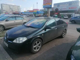 Nissan Primera 1.6 2007 года, черный цвет. VIN: SJNFAAP12U2313909, ПТС: 99 49 823711, госномер: С325АЕ196. Двигатель бензиновый QG16-087203Q, мощность 109 л.с. (80,1 кВт), объем 1597 см³. Экологический класс нулевой, разрешенная максимальная масса 1940 кг, масса без нагрузки 1396 кг.