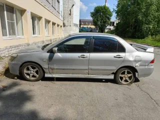 Мицубиси Lancer 1.6, VIN JMBSNCS3A5U005993, 2004 г., госномер М656ХУ 35, серебристый, на ходу
