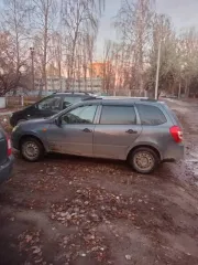 Lada Kalina 2014 года, 87 лс, пробег 180000 км. Цвет: серебристо-темно-серый. VIN: XTA219410E0039511, ПТС: 63ХН317145, госномер: Е543ЕХ73. Страна-изготовитель: Россия, объем двигателя: 1596 см³, мощность: 87 лс (64 кВт).