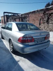 Автомобиль Mazda Capella 2000 года выпуска, серебристый цвет. Государственный номер А245РР27. Кузов GF8P 201936. Разрешенная максимальная масса 1490 кг, масса без нагрузки 1180 кг.