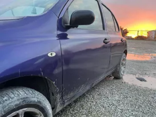 Автомобиль Nissan March, год выпуска 2002, VIN AK12031344, цвет кузова сиреневый.