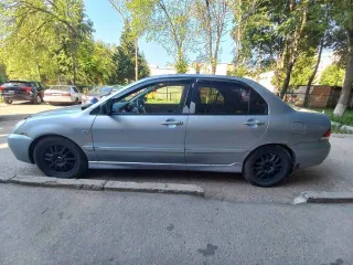 Mitsubishi Lancer 2004 года, 98 л.с., пробег 250000 км, АКПП. Транспортное средство Mitsubishi Lancer 1.6, 2004 года выпуска, регистрационный номер М110НТ21, VIN JMBSRCS3A5U006276.