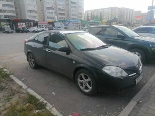 Nissan Primera 1.6 2007 года, черный цвет. VIN: SJNFAAP12U2313909, ПТС: 99 49 823711, госномер: С325АЕ196. Двигатель бензиновый QG16-087203Q, мощность 109 л.с. (80,1 кВт), объем 1597 см³. Экологический класс нулевой, разрешенная максимальная масса 1940 кг, масса без нагрузки 1396 кг.