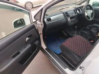 Nissan Tiida (Тиида) 2010 года, 110 лс, 218702 км, АКПП, цвет белый, рабочий объем двигателя 1 498, государственный регистрационный знак Н642НМ 03.