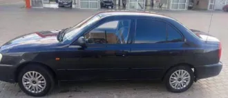 Hyundai Accent 2007 года, 75 лс, 200 000 км. Легковой автомобиль, марка: ХЕНДЭ АКЦЕНТ, год изготовления: 2007, цвет: Черный, VIN: X7MCF41GP7A102042, г/н: T062HE30, мощность двигателя, л. с. (кВт): 75/102.0, рабочий объем двигателя, куб. см: 1495, экологический класс: ТРЕТИЙ/3 (пробег указан не…