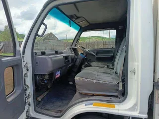 Nissan Atlas 1992 года, государственный номер Р322КЕ124. VIN отсутствует.