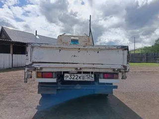 Nissan Atlas 1992 года, государственный номер Р322КЕ124. VIN отсутствует.