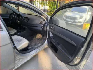 Mitsubishi Lancer 2011 Легковой седан Mitsubishi Lancer 1,5, VIN: JMB5NCY2ABU006835, год выпуска: 2011, цвет: бежевый, тип двигателя: бензиновый, мощность двигателя: 109 л.с. (80,2 кВт), объем двигателя: 1499 куб.см., экологический класс: четвертый. По периметру автомобиля наблюдаются очаги…