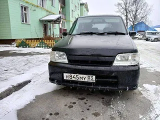 Nissan Cube 2000 года, госномер Н845МУ03, черный цвет. VIN: AZ10039628, двигатель бензиновый 1.3 л (85 л.с.), снаряженная масса 980 кг, полная масса 1200 кг. Производство: Япония.