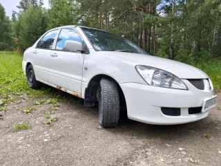 Мицубиси Лансер 2003 года выпуска номер двигателя 4G15CX0816 цвет белый