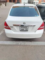 Nissan Tiida (Тиида) 2010 года, 110 лс, 218702 км, АКПП, цвет белый, рабочий объем двигателя 1 498, государственный регистрационный знак Н642НМ 03.