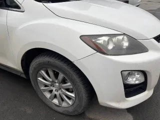 Mazda CX-7, 2011 Mazda CX-7, 2011 года, 163 лс, 134000 км, АКПП, Автомобиль MAZDA CX-7, 2011 года выпуска, VIN: JMZER19L700234899. Техническое состояние автомобиля: стартер при запуске не включается, спущены колеса, зимние шины. ЛКП заводское за исключением некоторых деталей.
