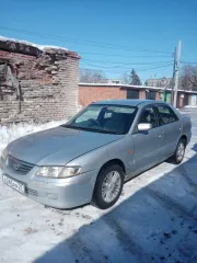 Автомобиль Mazda Capella 2000 года выпуска, серебристый цвет. Государственный номер А245РР27. Кузов GF8P 201936. Разрешенная максимальная масса 1490 кг, масса без нагрузки 1180 кг.