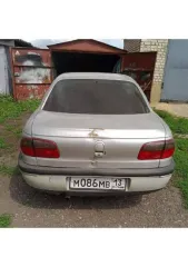 Opel Omega 1996 года выпуска, цвет серебристый (белый), номерной знак MO86MB13, VIN: W0L000026T1115447. Автомобиль на ходу, на зимней резине. Прогорела выхлопная система, климат не работает, трещина на лобовом стекле, проблемы с маслом. Основные лампочки горят. Горит чек, на движение не влияет…