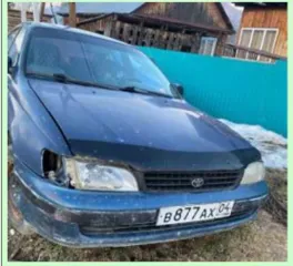 Toyota Karina E 1993 года, госномер В877АХ04, VIN JT153STK100028726. Состояние: вмятины по кузову, на правом крыле со стороны багажника белое пятно.