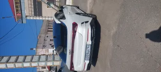 KIA K5, 2023, транспортное средство: автомобиль, марка KIA, модель K5, идентификационный номер MX1G2414BPK214140, год изготовления 2023, номер кузова MX1G2414BPK214140, цвет кузова белый.
