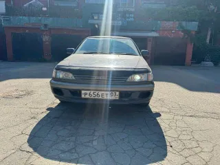 Toyota Carina, 1990 год выпуска, регистрационный знак Р656ЕТ03RUS, VIN не установлен, цвет темно-синий.