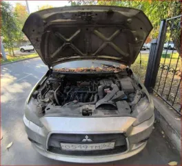 Mitsubishi Lancer 2011 Легковой седан Mitsubishi Lancer 1,5, VIN: JMB5NCY2ABU006835, год выпуска: 2011, цвет: бежевый, тип двигателя: бензиновый, мощность двигателя: 109 л.с. (80,2 кВт), объем двигателя: 1499 куб.см., экологический класс: четвертый. По периметру автомобиля наблюдаются очаги…