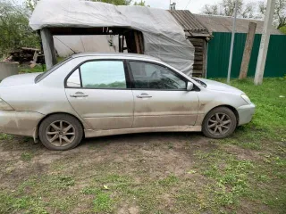 Мицубиси лансер 1,6 2003 года, VIN JMBSRCS3A4U002962.