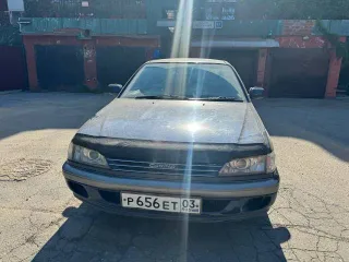 Toyota Carina, 1990 год выпуска, регистрационный знак Р656ЕТ03RUS, VIN не установлен, цвет темно-синий.