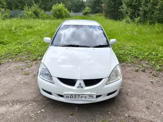 Мицубиси Лансер 2003 года выпуска номер двигателя 4G15CX0816 цвет белый