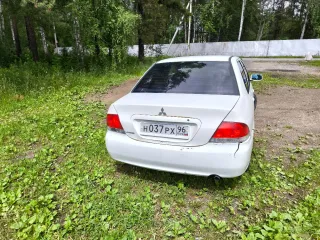 Мицубиси Лансер 2003 года выпуска номер двигателя 4G15CX0816 цвет белый