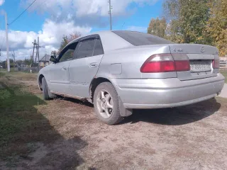 Mazda Capella 1999 года выпуска, цвет светло-серый, VIN отсутствует.
