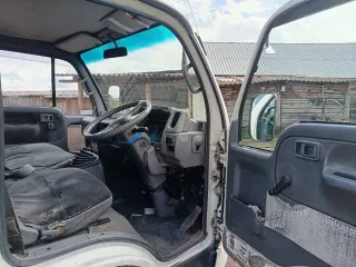 Nissan Atlas 1992 года, государственный номер Р322КЕ124. VIN отсутствует.