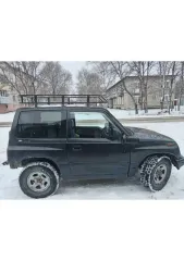 Suzuki Escudo 1995 года выпуска. Идентификационный номер (VIN) отсутствует. Модель, № двигателя: G16A-41460, шасси (рама) № TA01W. Цвет кузова: черный. Мощность двигателя 100 л.с. (75 кВт), рабочий объем 1590 куб.см. Разрешенная максимальная масса 1350 кг, масса без нагрузки 1130 кг…